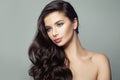 Perfect brunette woman with long curly hairstyle. Hair care and beauty salon background Royalty Free Stock Photo