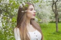 Perfect brunette woman portrait. Beautiful female model with long hair and make-up in spring garden outdoor Royalty Free Stock Photo