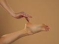 Perfect clean female feet . Beautiful and elegant groomed woman`s hand touching her foot . Spa ,scrub and foot care