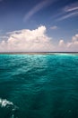 Perfect cloudy sky and turquoise water of ocean Royalty Free Stock Photo