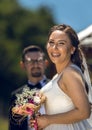 A beatiful bride is making a pose in front of groom. Royalty Free Stock Photo