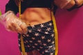 Almost perfect. Cropped closeup shot of a fitness woman with sporty toned body measuring her waist copyspace on the side Royalty Free Stock Photo