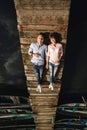 Perfect date. Beautiful young couple and smiling while lying on the pier