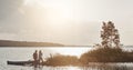 Perfect date for the outdoorsy types. a young couple going for a canoe ride on the lake.