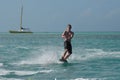 Perfect Day in Aruba Riding a Wakeboard on the Ocean Royalty Free Stock Photo