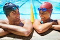 The perfect day for a swim. Two young swimmers smiling braodly at the camera as they stand in the pool. Royalty Free Stock Photo