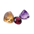 Perfect dazzling faceted gems. Rhodolite garnet, quartz citrine and quartz amethyst. Luxury jewels Royalty Free Stock Photo