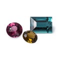 Perfect dazzling faceted gems. Rhodolite garnet, tourmaline and tourmaline indigolite. Luxury jewels Royalty Free Stock Photo