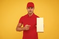 Perfect delivery. Delivery man yellow background. Express delivery courier. Parcel post package. Targeted Delivery