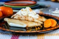 Pancakes with cheese on a plate. Cake with fruit. Home cooking. A sweet meal. Children`s favorite dish. Royalty Free Stock Photo