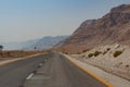 Perfect empty mountain road at a hot summer day