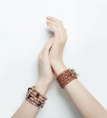 Perfect female hands with gold jewelry bracelet