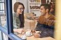 The perfect first date. a young couple sitting in a coffee shop on a date. Royalty Free Stock Photo