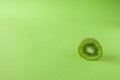 Perfect Fresh Green kiwi fruit Isolated on green Background Full Depth of Field