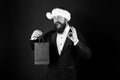 Perfect gift. Happy businessman show OK sign. Bearded man smile with gift in bag. Shopping for Christmas gift. Boxing Royalty Free Stock Photo