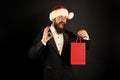 Perfect gift. Happy businessman show OK sign. Bearded man smile with gift in bag. Shopping for Christmas gift. Boxing Royalty Free Stock Photo