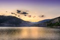 Perfect golden hour over reflective lake and horizon rocky mountains Royalty Free Stock Photo
