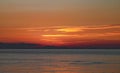 A perfect golden sunset over a calm sea