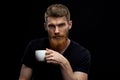 Perfect hairstyle bearded man drinking espresso