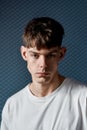 Perfect hairstyle. Portrait of a handsome young man in white T-shirt with stylish haircut looking at the camera while Royalty Free Stock Photo