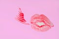 Perfect imprint of pink lipstick. Silhouette of pink lips isolated on white background. Qualitative trace of real lipstick texture Royalty Free Stock Photo