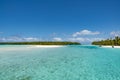 Perfect islands in turquoise clear water, deep blue sky, white sand, Pacific Island