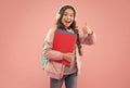 Perfect learning. Happy child give thumbs up pink background. Approval gesture. Hand sign. Little girl back to school