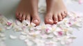Perfect legs on a background of flowers. Taking care of soft, smooth skin, spa treatments. Beauty salon for pedicure and Royalty Free Stock Photo