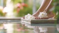 Perfect legs on a background of flowers. Taking care of soft, smooth skin, spa treatments. Beauty salon for pedicure and Royalty Free Stock Photo