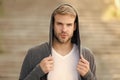 Perfect male. Fashionable young model man. man posing with hoodie. young street man with hood. Incognito Boy. handsome Royalty Free Stock Photo