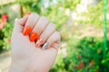 Perfect manicure and natural nails. Attractive modern nail art design. orange autumn design. long well-groomed nails Royalty Free Stock Photo