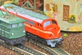 Perfect model of the electric locomotive and diesel locomotive. Train hobby model on the model railway. Close-up