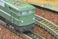 Perfect model of the electric locomotive. Train hobby model on the model railway. Close-up