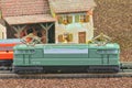 Perfect model of the electric locomotive. Train hobby model on the model railway. Close-up