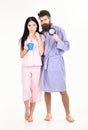 Perfect morning concept. Couple, family woke up on time. Couple in love, young family in pajama, bathrobe stand isolated Royalty Free Stock Photo