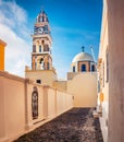 Perfect morning view of Catholic Cathedral Church of Saint John The Baptistm in Fira village, Greece, Europe. Sunny summer Santori Royalty Free Stock Photo