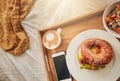 The perfect mothers day gift. A tray of a well balanced breakfast, a bagel, coffee and a cellphone. Everything needed Royalty Free Stock Photo