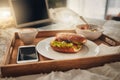 The perfect mothers day gift. A tray of a well balanced breakfast, a bagel, coffee and a cellphone. Everything needed Royalty Free Stock Photo