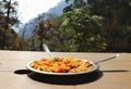 A perfect mountain travel shot with maggi and mountains and perfect weather