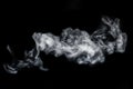 Perfect mystical curly horizontal white steam or smoke isolated on black background. Abstract background fog or smog