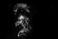 Perfect mystical curly white steam or smoke isolated on black background. Abstract background fog or smog