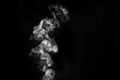 Perfect mystical curly white steam or smoke isolated on black background. Abstract background fog or smog,