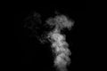 Perfect mystical curly white steam or smoke isolated on black background. Abstract background fog or smog