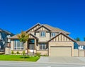 Big family house with concrete driveway and wide garage door Royalty Free Stock Photo