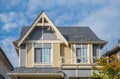 A perfect neighborhood. Houses in suburb in the north America. Top of a luxury house with nice windows over blue sky Royalty Free Stock Photo