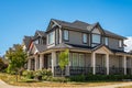 Perfect neighborhood.Houses in suburb at summer in the North America.Big custom houses with nicely landscaped front yard Royalty Free Stock Photo