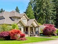 A perfect neighborhood. Luxury residential house with green lawn in front Royalty Free Stock Photo