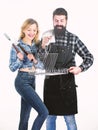 Perfect for ourdoor picnic. Bearded man and cute girl holding cooking grate with handle. Happy couple having grill grate Royalty Free Stock Photo