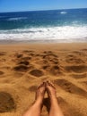 Perfect Paradise Feet up relaxing watching a glorious golden sunrise over the beach in Kauai Hawaii Royalty Free Stock Photo