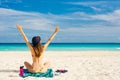 Paradise summer vacation happiness carefree happy woman relaxing sitting in sand enjoying tropical beach destination Royalty Free Stock Photo